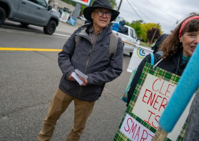 Group of protestors holding a sign at Mt Pleasant Citizens Climate Lobby at Alma Highland Festival 2026 5
