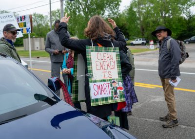 Group of protestors holding a sign at Mt Pleasant Citizens Climate Lobby at Alma Highland Festival 2026 9